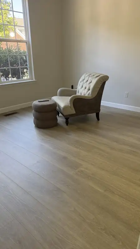 New wide-plank floor in a bright sitting room