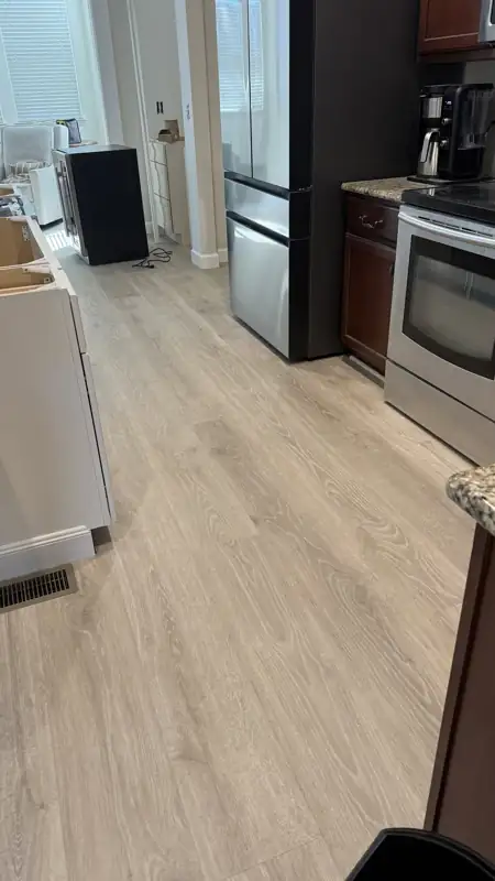 New flooring running through a kitchen